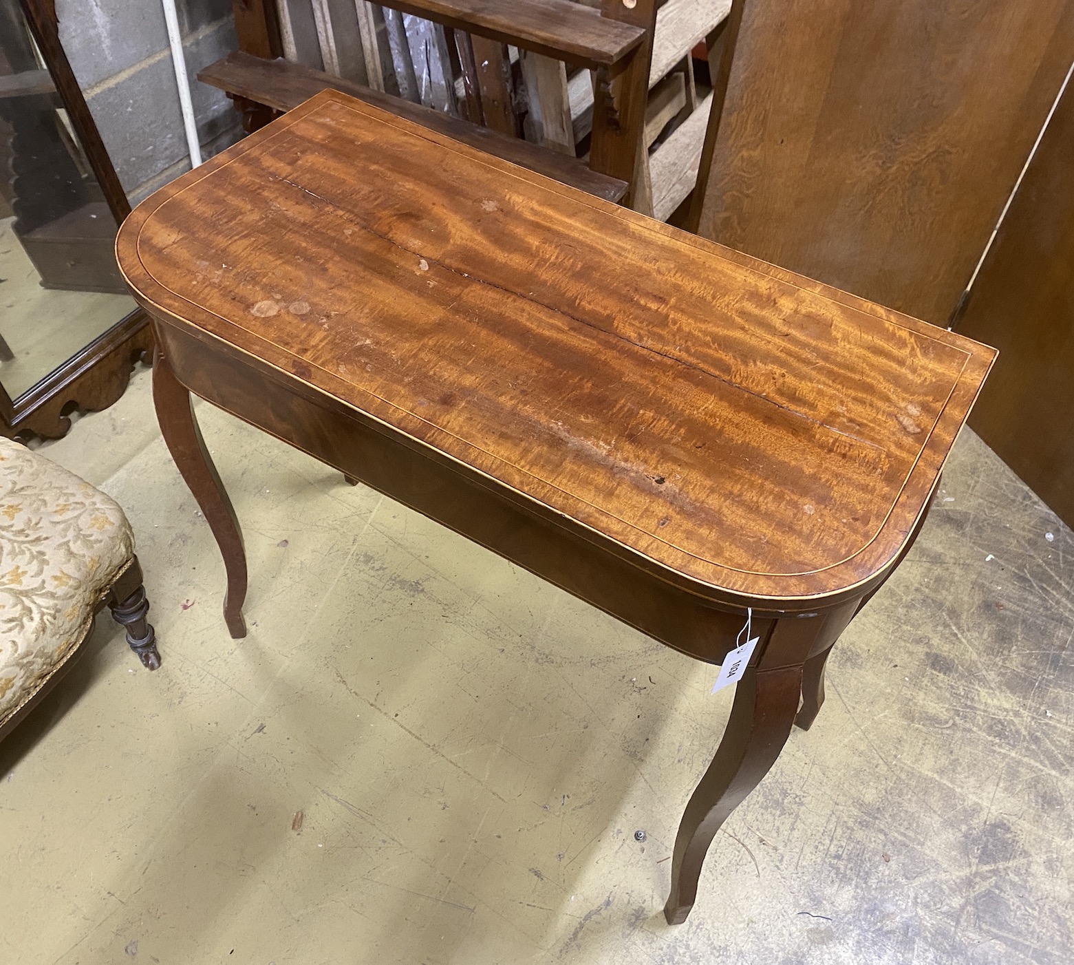 A George III banded mahogany D shaped folding card table, width 88cm, depth 45cm, height 74cm